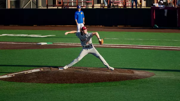 Carter Harrington throwing a pitch against UNCW.