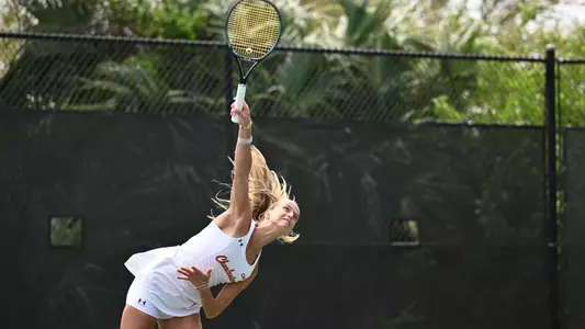 Francesca Salvato serves tennis ball