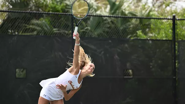 Francesca Salvato serves tennis ball