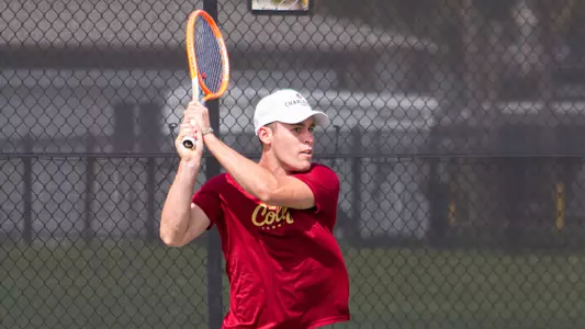 Jordy Larke Swings Tennis Racket