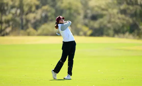 Molly Hardwick finishes her swing
