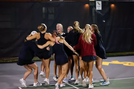 Women's tennis team celebrates win over Campbell