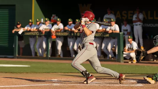 Dylan Johnson swinging a bat at William & Mary.