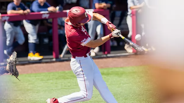 Will Tippett swinging a bat at Patriots Point.