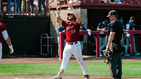 Landon Penfield celebrating a home run at Patriots Point.