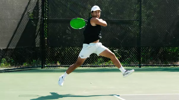 Eddie Vo hits tennis ball