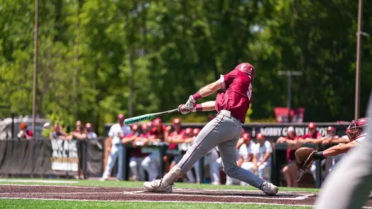 Dylan Johnson hitting a baseball May 10 at Elon.