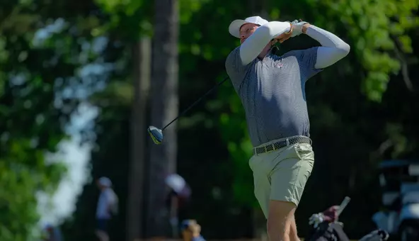 Nevill Ruiter swings the club
