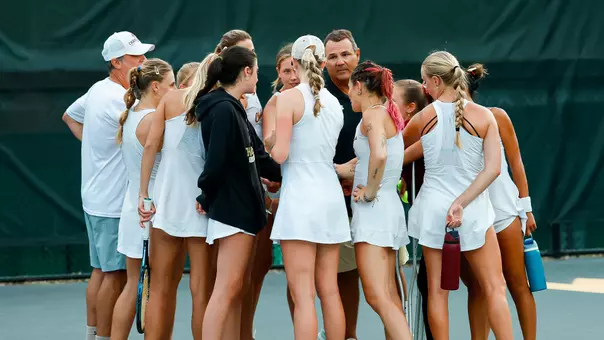 Women's Tennis Team Huddles