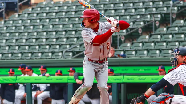 Reece Holbrook swinging a baseball bat vs Illinois.