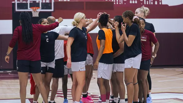 WBB Team Huddles at practice