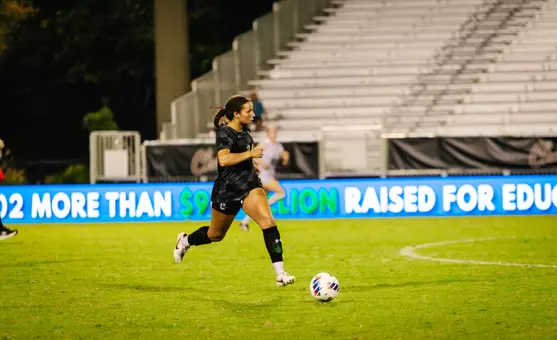 Casey Malone running down the field with the ball