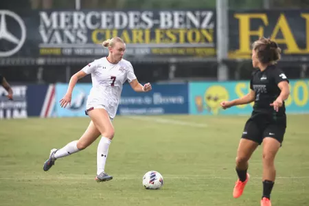 Mary Martin Spinner running down field with the ball