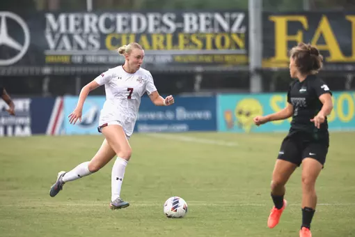 Mary Martin Spinner running down field with the ball