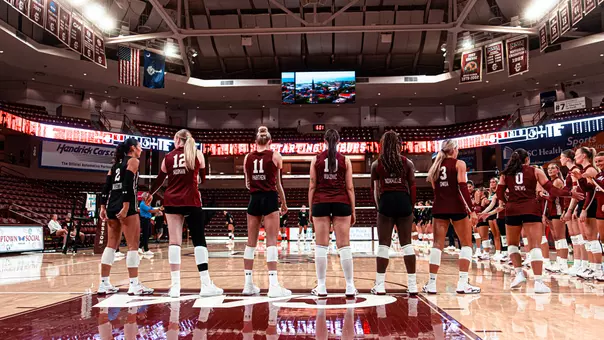 Charleston volleyball standing pregame in TD Arena.