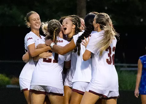 Women's Soccer celebrating goal