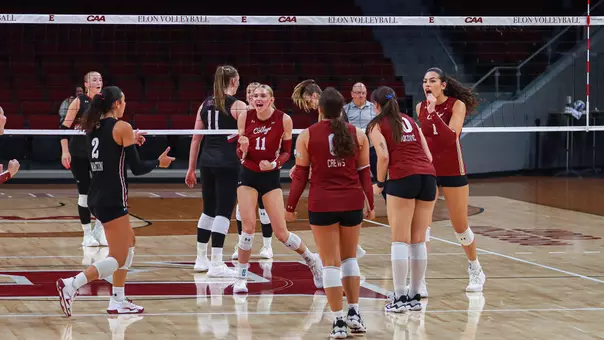 Makena Parthen and Gabby Tuiaana celebrating a block Sept. 20 at Elon.