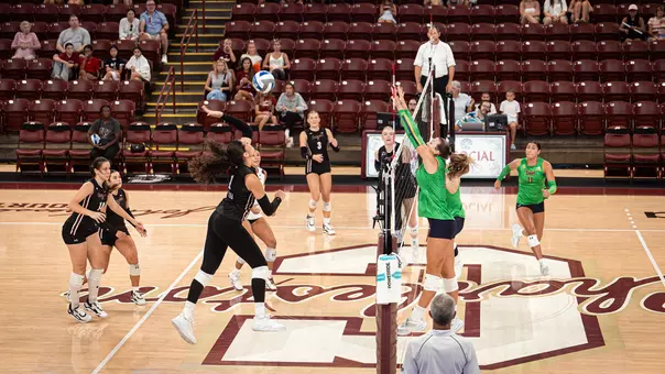 Gabby Tuiaana readying to swing a volleyball vs Notre Dame.