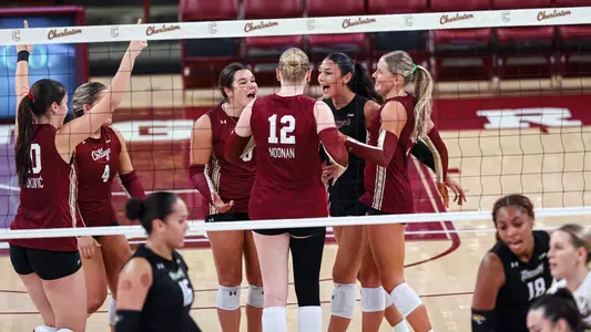 Charleston volleyball celebrating a point vs Towson.
