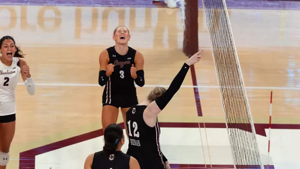 Julia Gnida and Caroline Noonan celebrating a Charleston point.