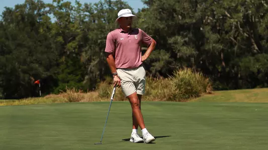 Johan Bredenkamp looking at a hole on the green.