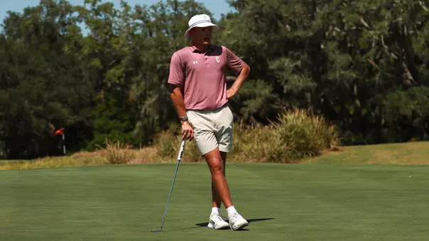 Johan Bredenkamp looking at a hole on the green.