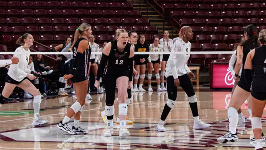 Caroline Noonan celebrating a point against Towson.