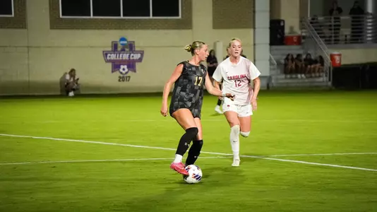 Kassy Uzelman dribbling the ball