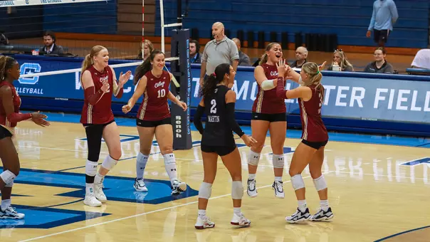 Charleston volleyball celebrating an ace at The Citadel.