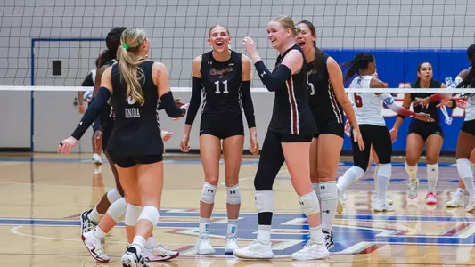 Charleston volleyball celebrating a point Sept. 8 at Presbyterian.