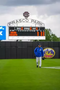Coach Ed Servais walks towards the dugout through the outfield of Prasco Park before his team plays a game during the BIG EAST Tournament.
