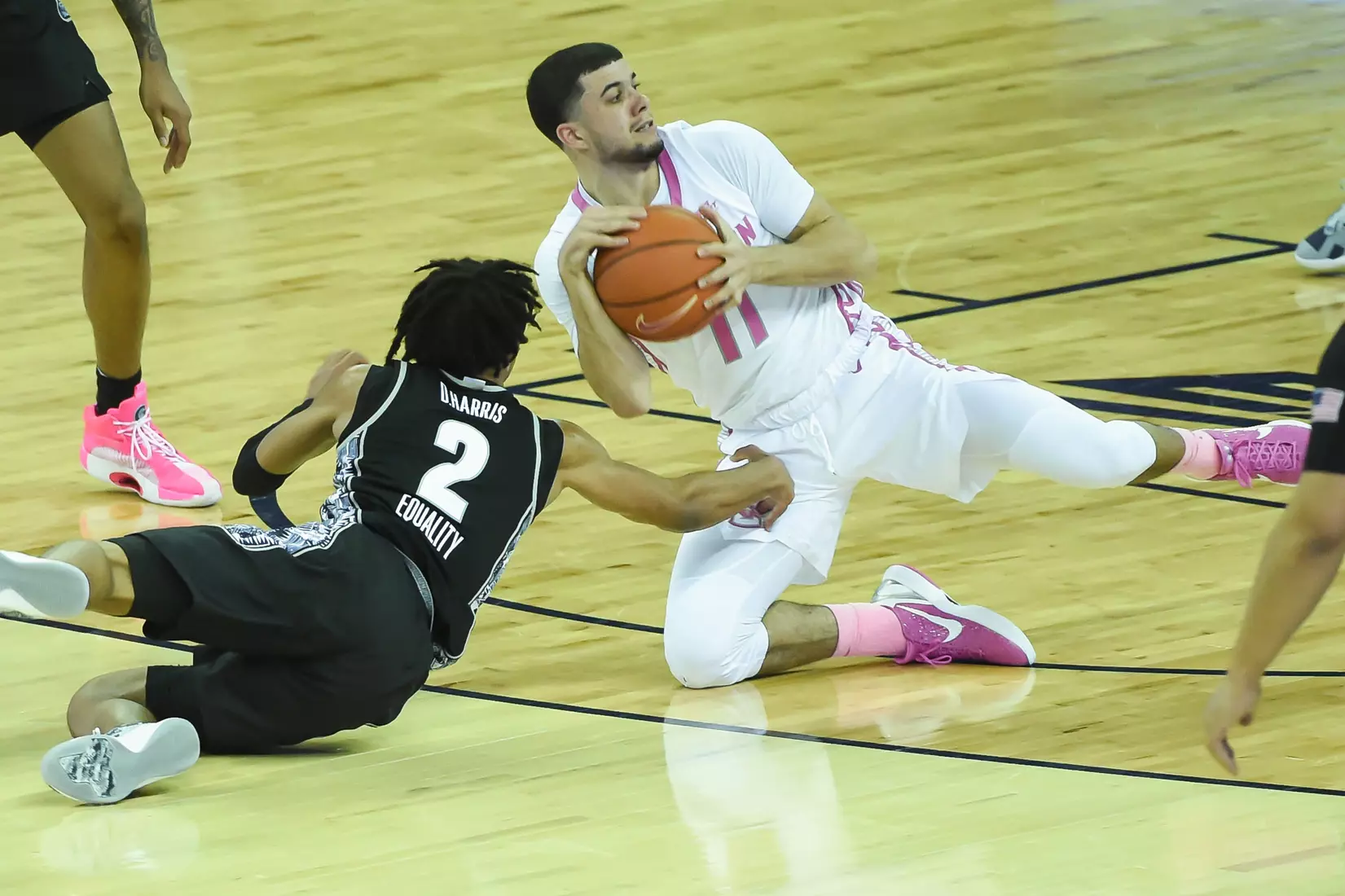 Feb 3, 2021; Omaha, Nebraska, USA; Creighton Bluejays guard Marcus Zegarowski (11) grabs a loose ball from Georgetown Hoyas guard Dante Harris (2) in the first half at CHI Health Center Omaha. Mandatory Credit: Steven Branscombe-USA TODAY Sports