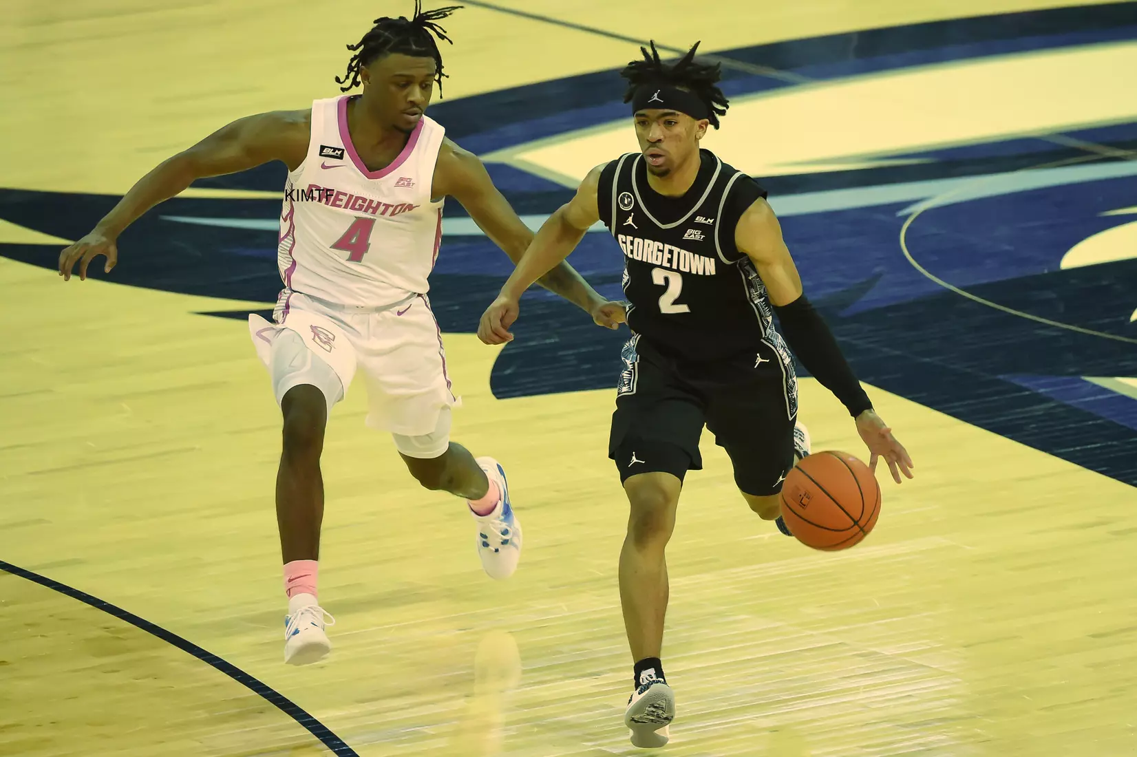 Feb 3, 2021; Omaha, Nebraska, USA; Georgetown Hoyas guard Dante Harris (2) dribbles by Creighton Bluejays guard Shereef Mitchell (4) in the first half at CHI Health Center Omaha. Mandatory Credit: Steven Branscombe-USA TODAY Sports