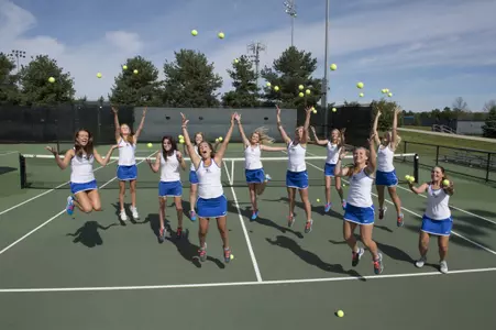 Women's Tennis team photo jumping