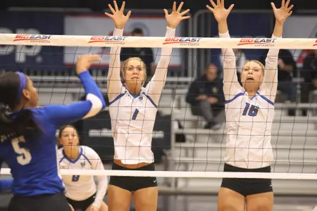 Lydia Dimke and Lauren Smith block