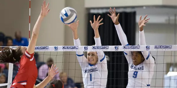 Lydia Dimke and Marysa Wilkinson with a block vs. St. John's