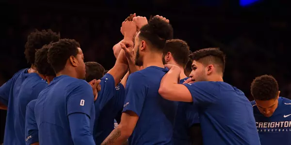 Men's Basketball huddle