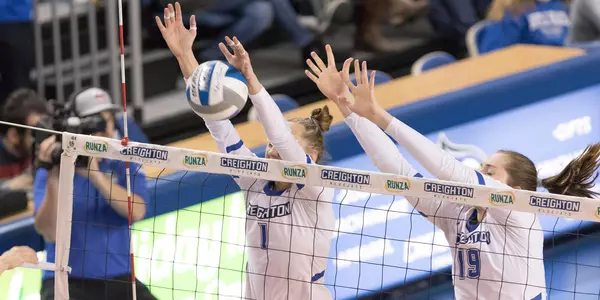 Kari Zumach and Megan Ballenger block