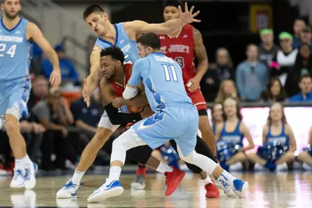Marcus Zegarowski is tied up by Shamorie Ponds