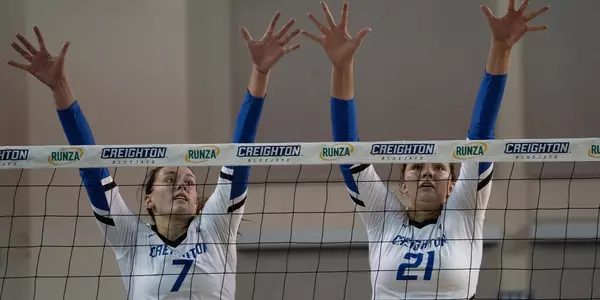 Naomi Hickman and Jaela Zimmerman block