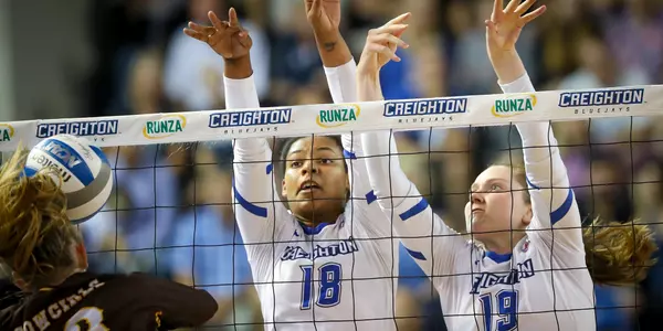 Madelyn Cole and Megan Ballenger block