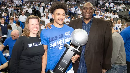BIG EAST trophy with Jordan Scurry family