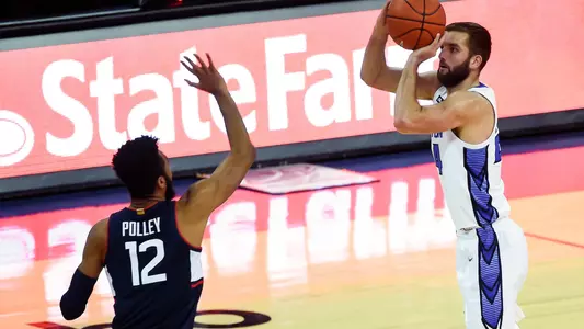 Jan 23, 2021; Omaha, Nebraska, USA;  Creighton Bluejays guard Mitch Ballock (24) attempts a three point basket against Connecticut Huskies forward Tyler Polley (12) in the second half at CHI Health Center Omaha. Mandatory Credit: Steven Branscombe-USA TODAY Sports