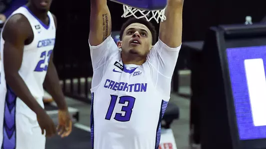 Jan 23, 2021; Omaha, Nebraska, USA;  Creighton Bluejays forward Christian Bishop (13) dunks on Connecticut Huskies forward Adama Sanogo (21) in the second half at CHI Health Center Omaha. Mandatory Credit: Steven Branscombe-USA TODAY Sports