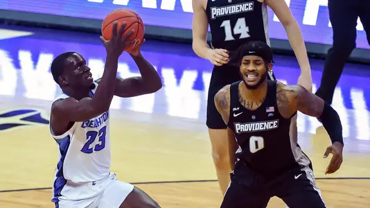 Jan 20, 2021; Omaha, Nebraska, USA;  Creighton Bluejays forward Damien Jefferson (23) scores against Providence Friars center Nate Watson (0) in the second half at CHI Health Center Omaha. Mandatory Credit: Steven Branscombe-USA TODAY Sports