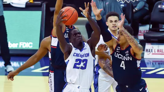 Jan 23, 2021; Omaha, Nebraska, USA;  Creighton Bluejays forward Damien Jefferson (23) shoots over Connecticut Huskies guard Tyrese Martin (4) in the first half at CHI Health Center Omaha. Mandatory Credit: Steven Branscombe-USA TODAY Sports