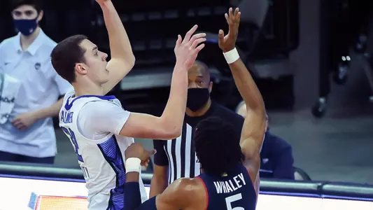 Jan 23, 2021; Omaha, Nebraska, USA;  Creighton Bluejays enter Ryan Kalkbrenner (32) shoots over Connecticut Huskies forward Isaiah Whaley (5) in the first half at CHI Health Center Omaha. Mandatory Credit: Steven Branscombe-USA TODAY Sports