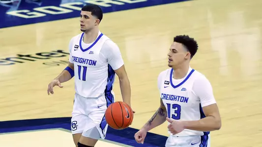 Jan 20, 2021; Omaha, Nebraska, USA;  Creighton Bluejays guard Marcus Zegarowski (11) and forward Christian Bishop (13) bring the ball down the court against the Providence Friars in the second half at CHI Health Center Omaha. Mandatory Credit: Steven Branscombe-USA TODAY Sports