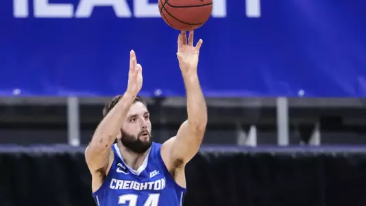 Jan 27, 2021; Newark, New Jersey, USA; Creighton Bluejays guard Mitch Ballock (24) makes a three point basket over Seton Hall Pirates guard Myles Cale (22) during the second half at Prudential Center. Mandatory Credit: Vincent Carchietta-USA TODAY Sports