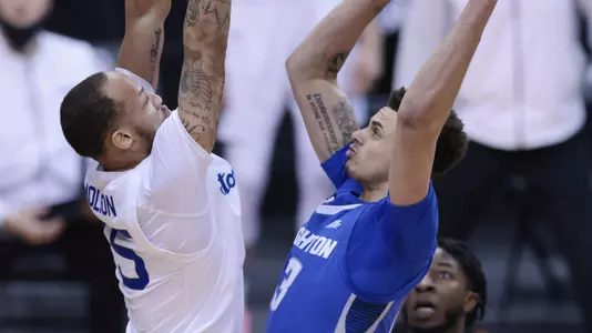 Jan 27, 2021; Newark, New Jersey, USA; Creighton Bluejays forward Christian Bishop (13) shoots the ball as Seton Hall Pirates guard Takal Molson (15) defends during the first half at Prudential Center. Mandatory Credit: Vincent Carchietta-USA TODAY Sports